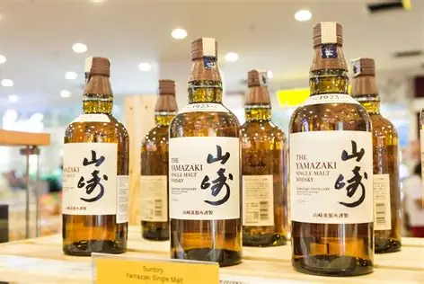 Is Japanese Whisky Worth the Price? From grain to glass showing barley fields, copper stills, Mizunara oak casks, and a neat pour